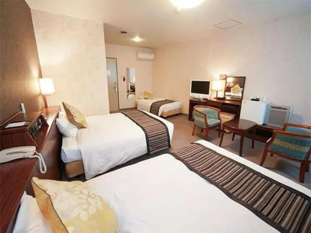 Bed in Hotel AreaOne Miyazaki City