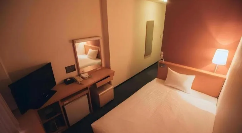 Bed in Hotel AreaOne Miyazaki City