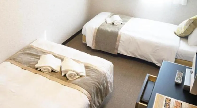 Bed in Hotel AreaOne Miyazaki City