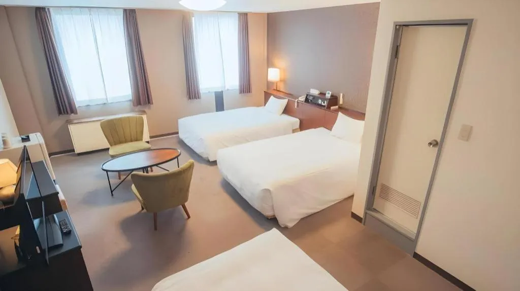 Bed in Hotel AreaOne Miyazaki City