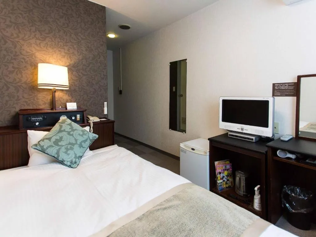 Bed in Hotel AreaOne Miyazaki City