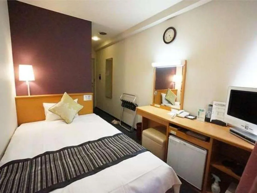 Bed in Hotel AreaOne Miyazaki City