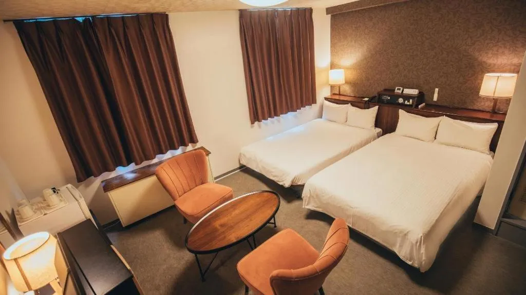 Bed in Hotel AreaOne Miyazaki City