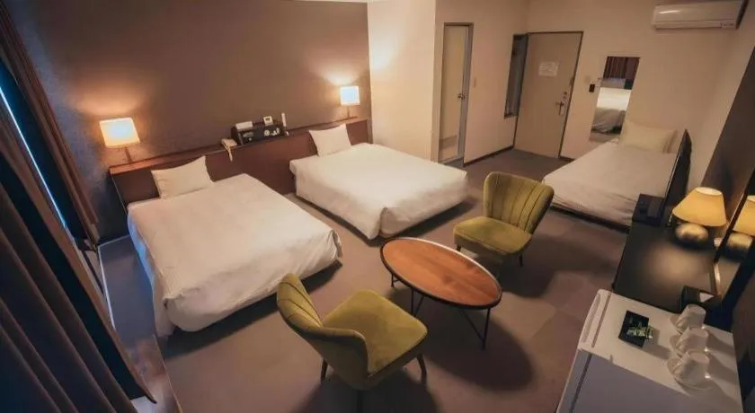 Bed in Hotel AreaOne Miyazaki City