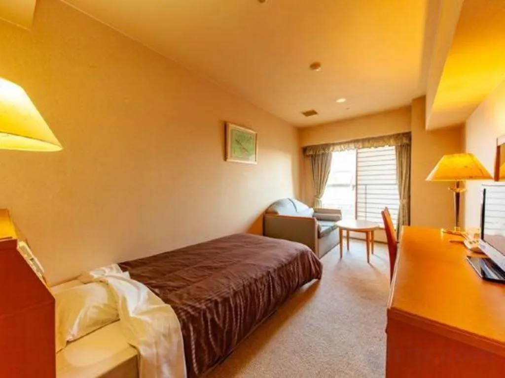 Bed in Hotel Takeshima