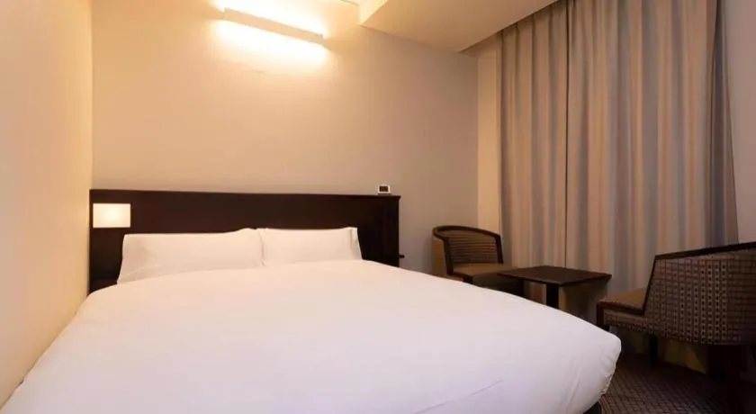 Bed in Takamatsu Park Hotel