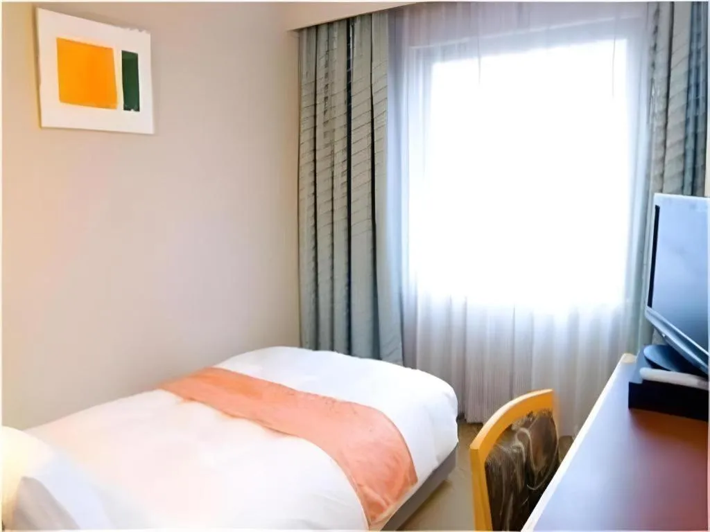 Bed in Takamatsu Park Hotel