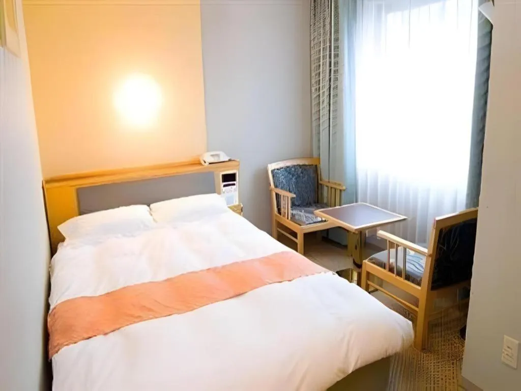 Bed in Takamatsu Park Hotel