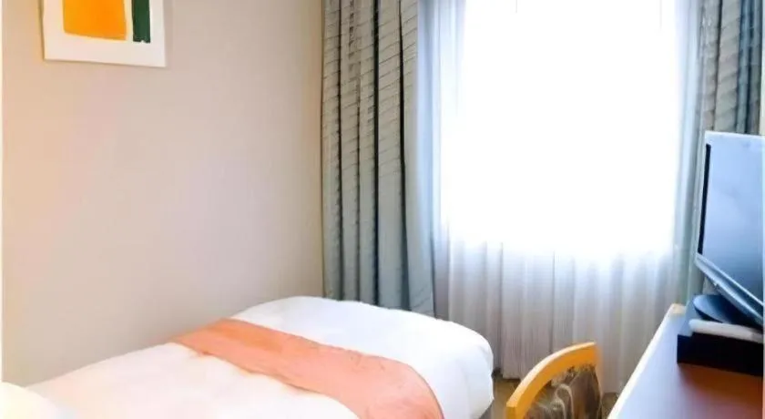 Bed in Takamatsu Park Hotel