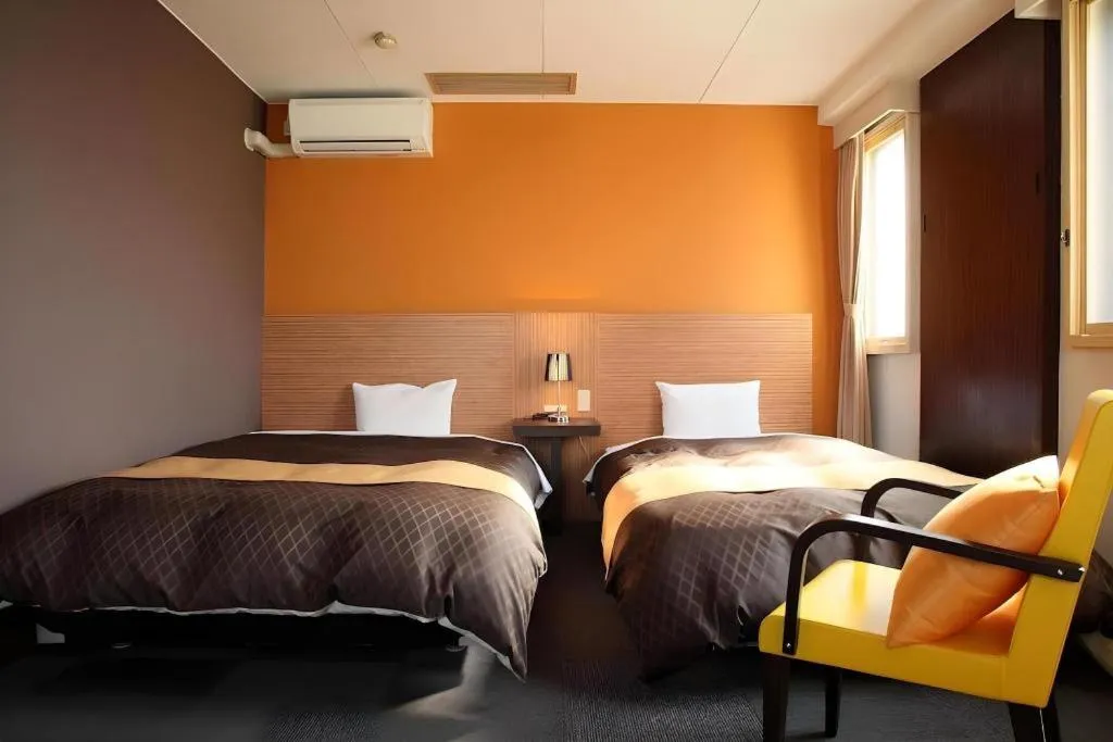 Bed in Hotel 1-2-3 Kofu Shingen Onsen