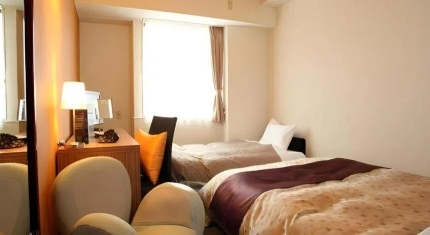 Bed in Hotel 1-2-3 Kofu Shingen Onsen