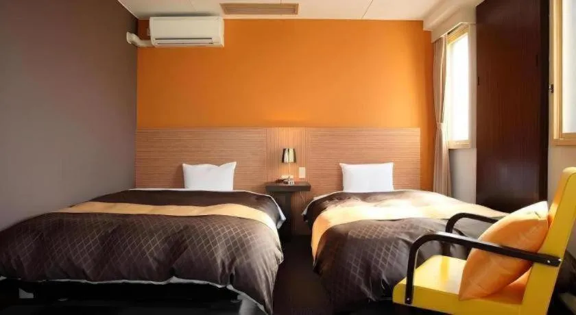 Bed in Hotel 1-2-3 Kofu Shingen Onsen