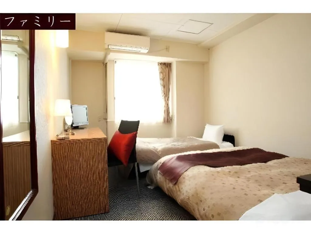 Bed in Hotel 1-2-3 Kofu Shingen Onsen