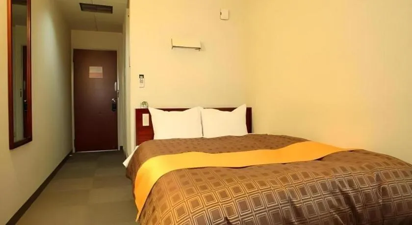 Bed in Hotel 1-2-3 Kofu Shingen Onsen