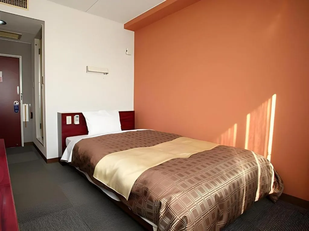 Bed in Hotel 1-2-3 Kofu Shingen Onsen