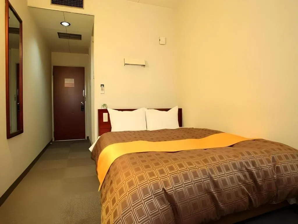 Bed in Hotel 1-2-3 Kofu Shingen Onsen