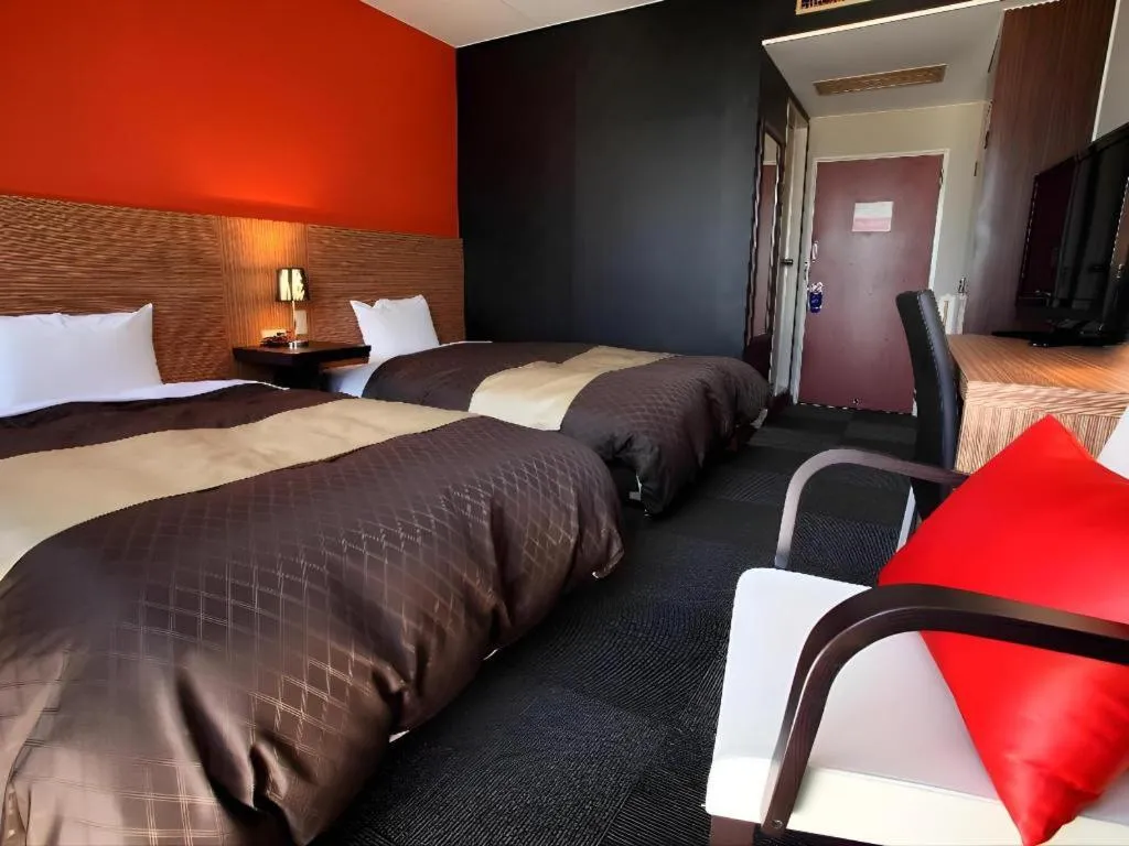 Bed in Hotel 1-2-3 Kofu Shingen Onsen