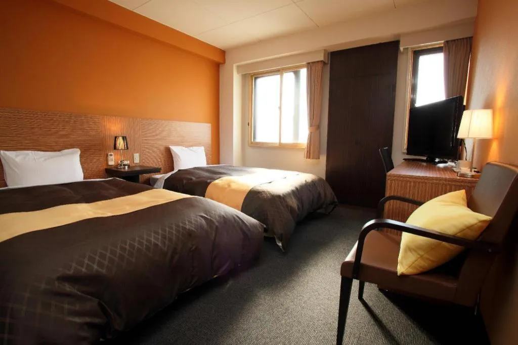 Bed in Hotel 1-2-3 Kofu Shingen Onsen