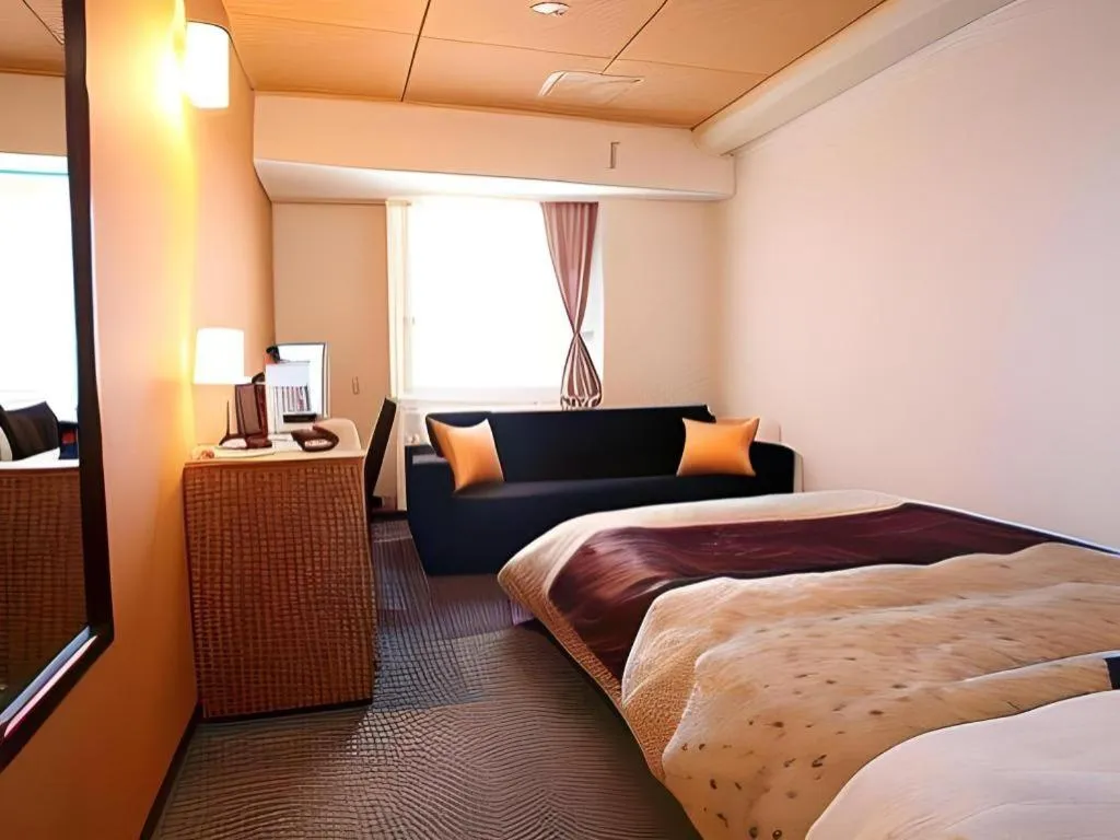 Bed in Hotel 1-2-3 Kofu Shingen Onsen