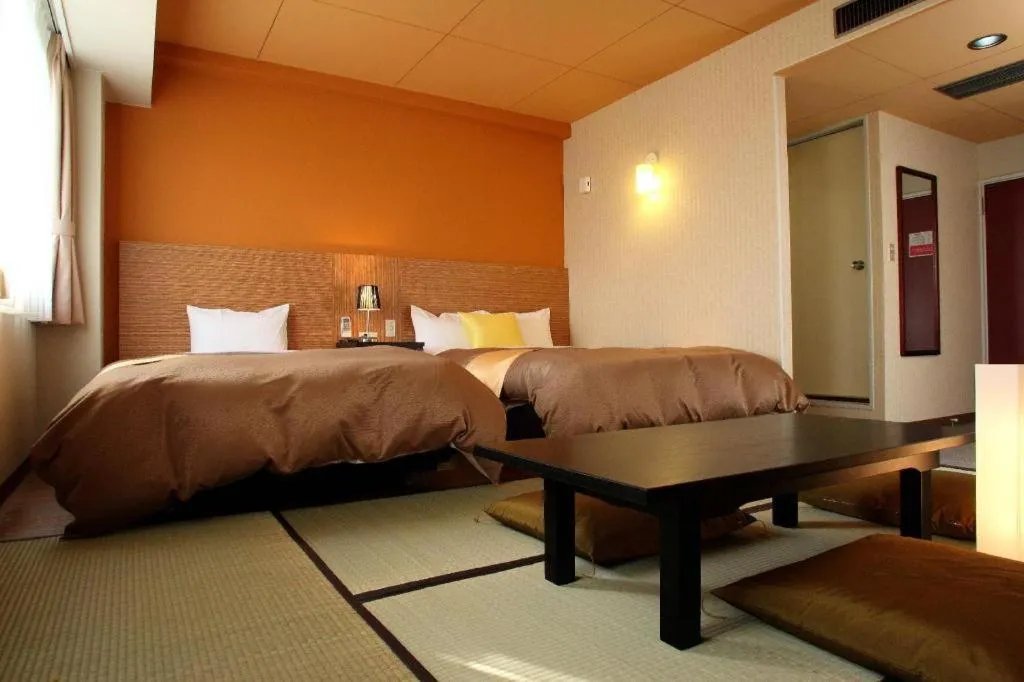 Bed in Hotel 1-2-3 Kofu Shingen Onsen