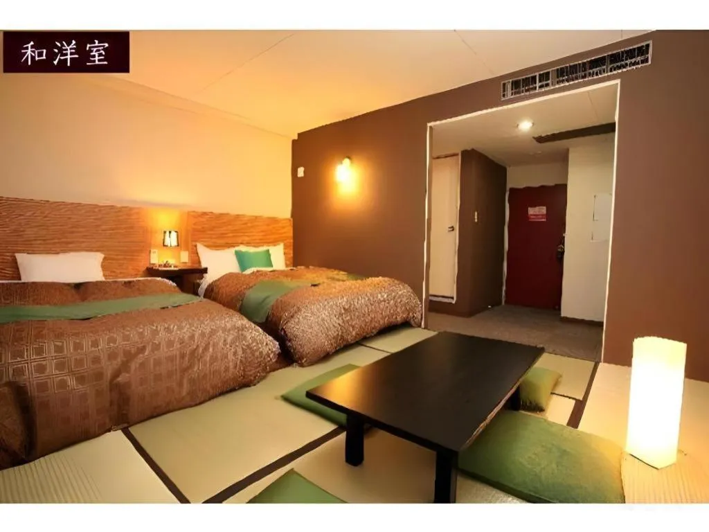 Bed in Hotel 1-2-3 Kofu Shingen Onsen