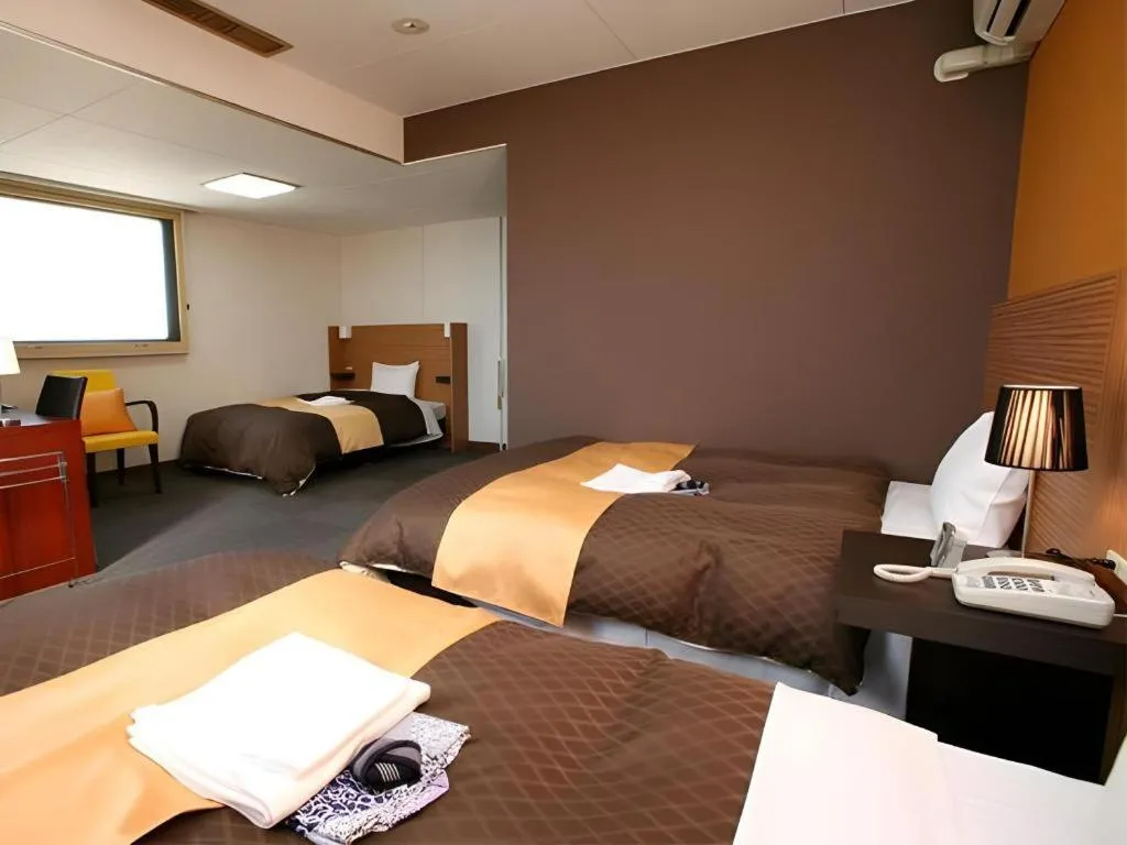 Bed in Hotel 1-2-3 Kofu Shingen Onsen