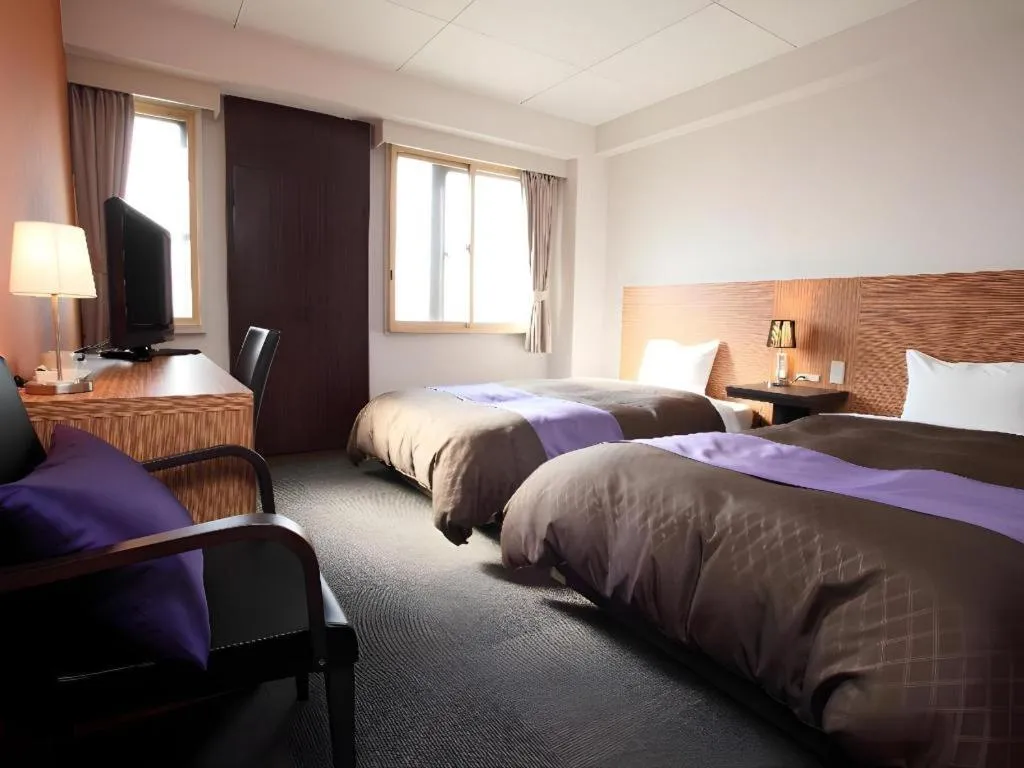 Bed in Hotel 1-2-3 Kofu Shingen Onsen