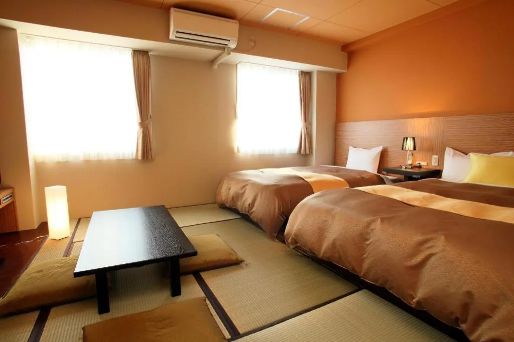 Bed in Hotel 1-2-3 Kofu Shingen Onsen