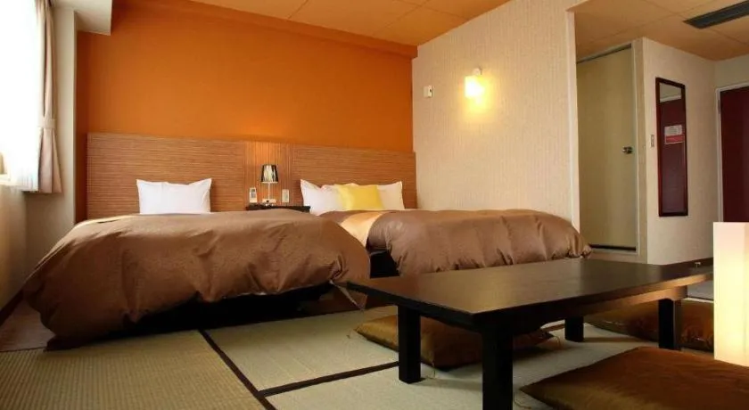 Bed in Hotel 1-2-3 Kofu Shingen Onsen