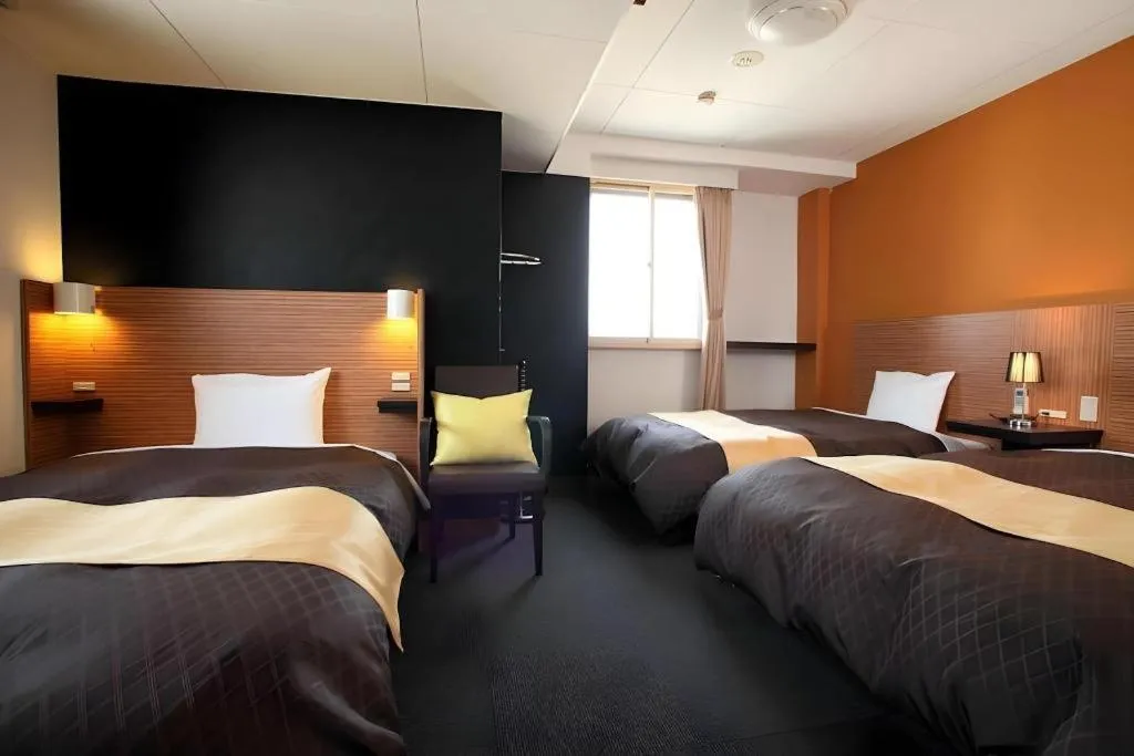 Bed in Hotel 1-2-3 Kofu Shingen Onsen