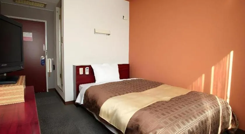 Bed in Hotel 1-2-3 Kofu Shingen Onsen