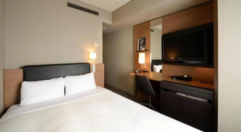 Bed in HOTEL UNIZO Osaka Yodoyabashi