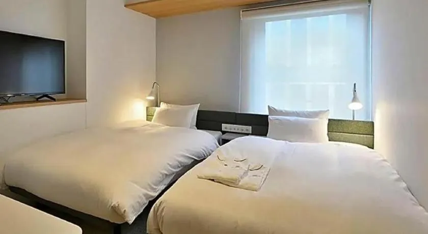 Bed in HOTEL UNIZO Osaka Yodoyabashi