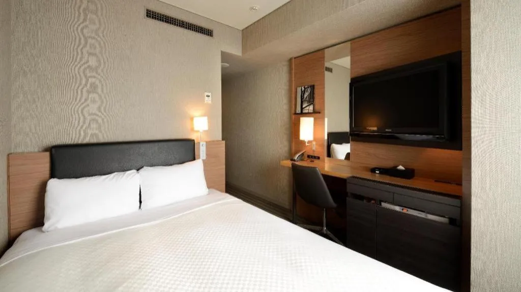 Bed in HOTEL UNIZO Osaka Yodoyabashi