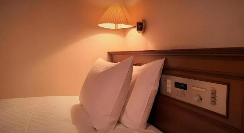 Bed in Hotel Harvest In Yonago