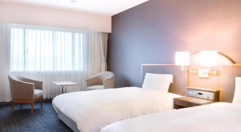 Bed in Imazu Sun Bridge Hotel