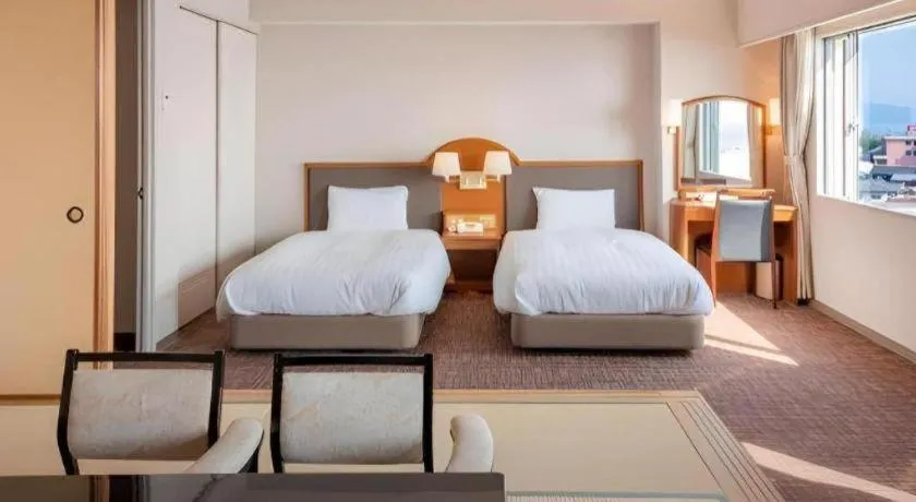 Bed in Imazu Sun Bridge Hotel