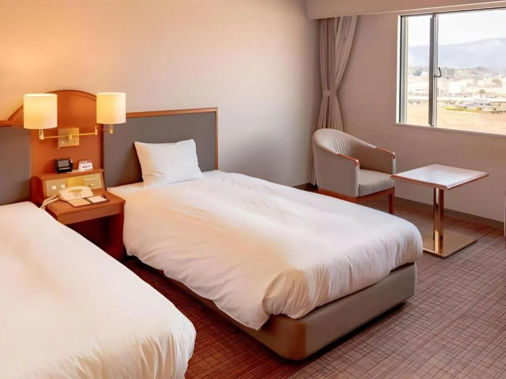 Bed in Imazu Sun Bridge Hotel