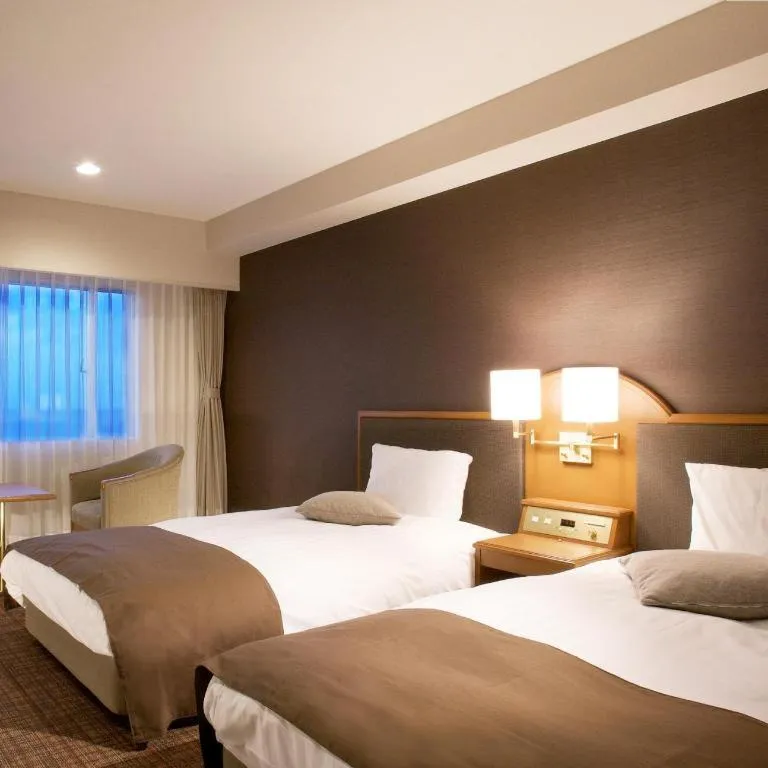 Bed in Imazu Sun Bridge Hotel