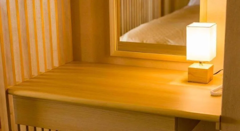 Bed in Shinojima Royal Hotel Kasuisou