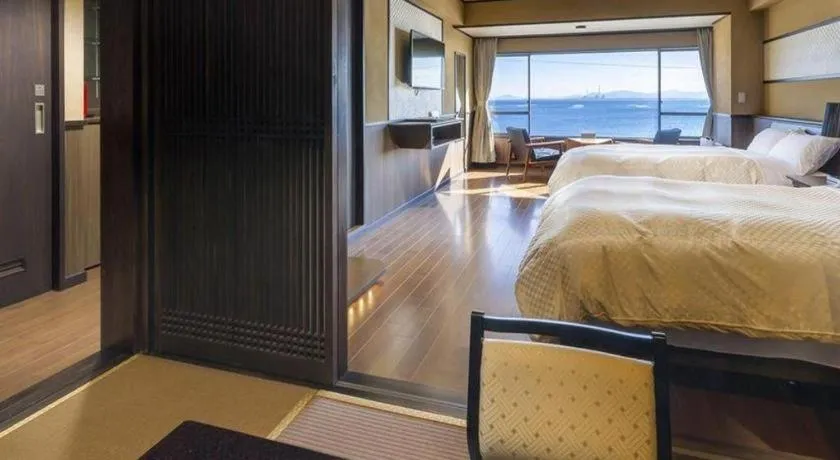 Bed in Shinojima Royal Hotel Kasuisou