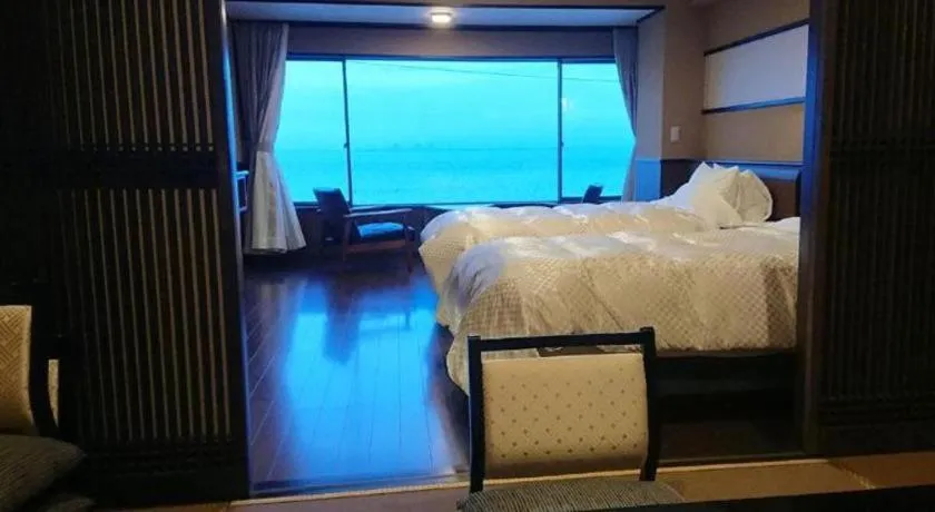 Bed in Shinojima Royal Hotel Kasuisou