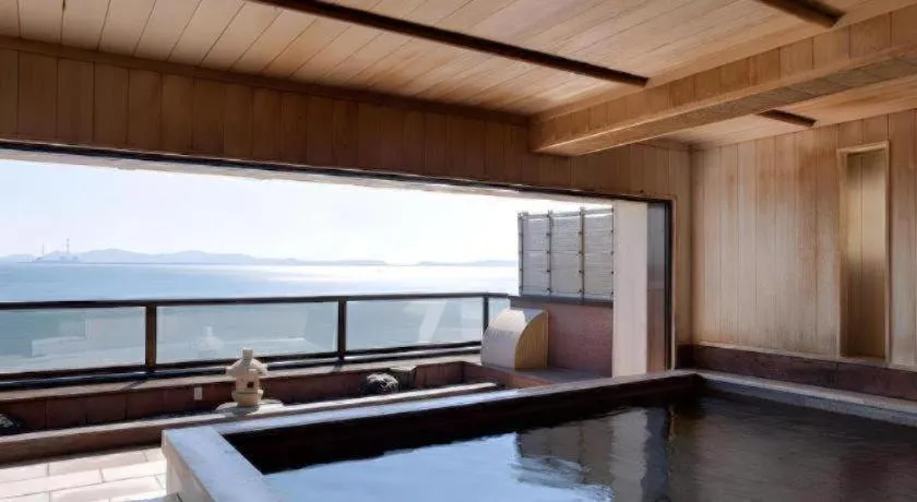 Bed in Shinojima Royal Hotel Kasuisou