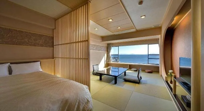 Bed in Shinojima Royal Hotel Kasuisou