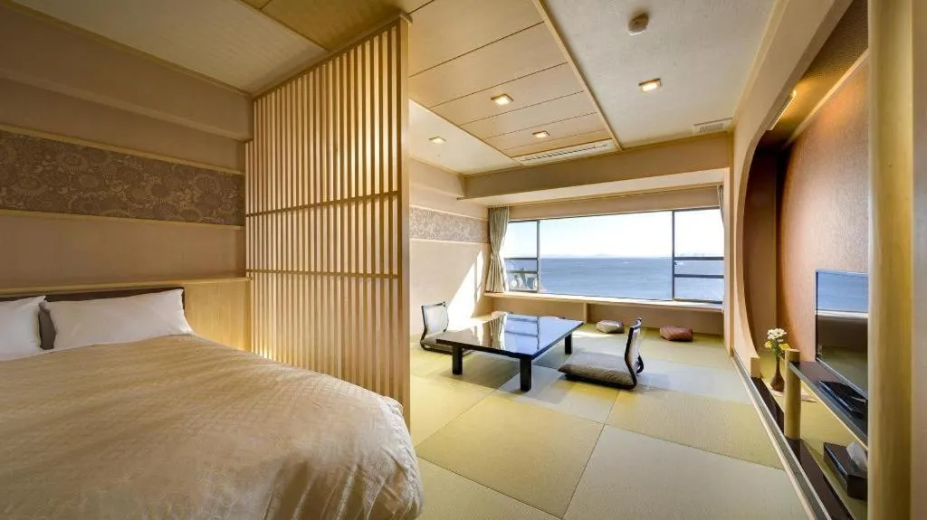 Bed in Shinojima Royal Hotel Kasuisou