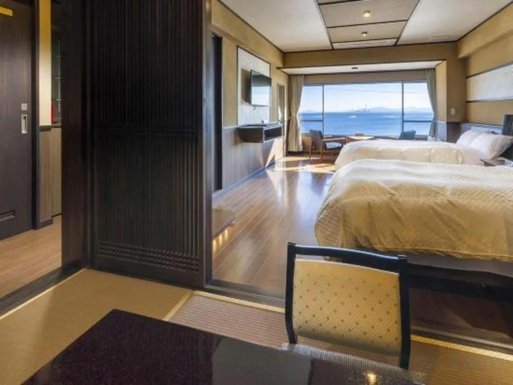 Bed in Shinojima Royal Hotel Kasuisou