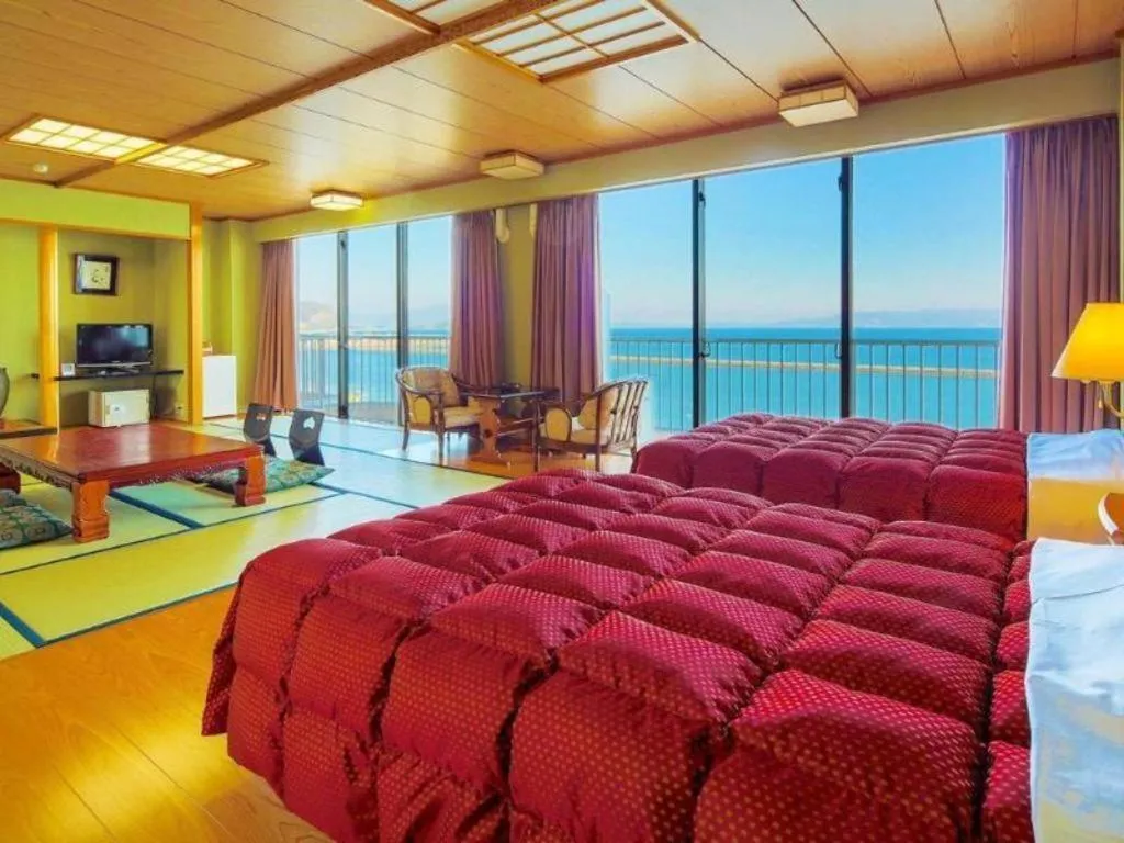 Bed in Ibusuki Onsen Hotel Shougetsu