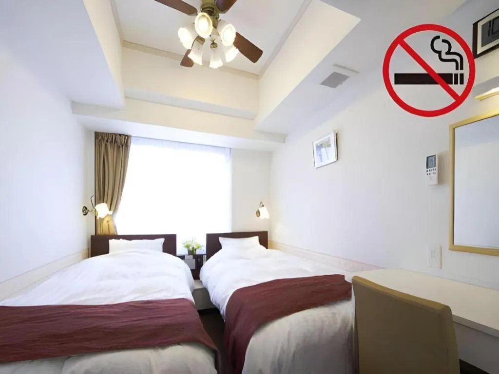 Bed in Hotel Shimbashi Sambankan