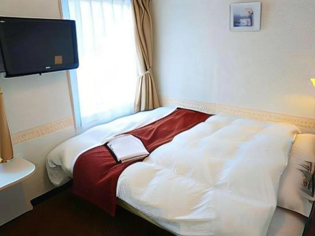 Bed in Hotel Shimbashi Sambankan