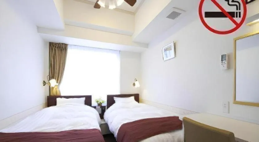 Bed in Hotel Shimbashi Sambankan